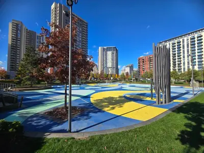 a park in a city with tall buildings at BW Eterna deluxe apartments in Belgrade