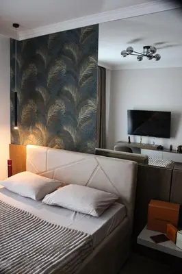 a bedroom with a large bed with a large mirror at Luxurious 2BR Designer Apartment Near River & Park in Belgrade