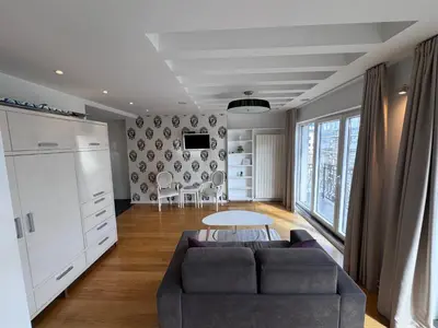 a living room with a couch and a table at City View Apartments in Belgrade
