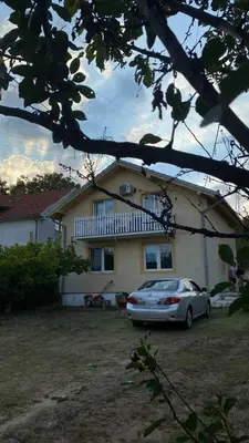 a car parked in front of a house at Cozy House Belgrade in Kalugjerica