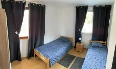 a small bedroom with a bed and a window at Cozy House Belgrade in Kalugjerica
