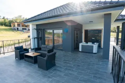 a patio with two chairs and a table at Kosmaj Sunrise in Rogača