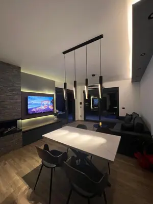 a living room with a table and a couch at Kosmaj Sunrise in Rogača