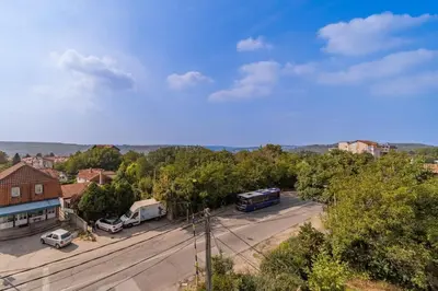 a view of a parking lot with cars and buses at Forty One Luxury Spa in Belgrade