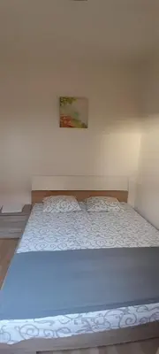 a large bed in a room with at Airport Guesthouse Rooms and Apartmants in Beograd