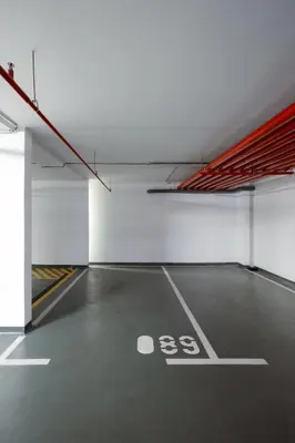 an empty parking lot in a parking garage at Central Garden Apartment - Parking & Security in Belgrade
