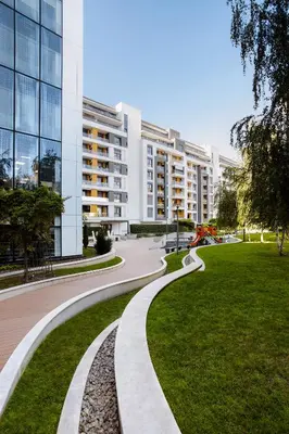 a walkway in front of a building at Central Garden Apartment - Parking & Security in Belgrade