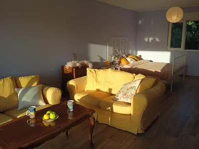 a living room with a couch and a table at ART HOUSE Kosmaj 2 in Sopot