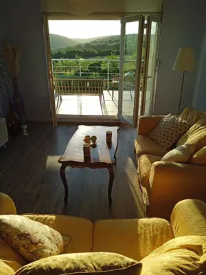 a living room with a couch and a coffee table at ART HOUSE Kosmaj 2 in Sopot