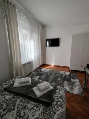 a bedroom with a bed with two pillows on it at Apartment 20 in Belgrade