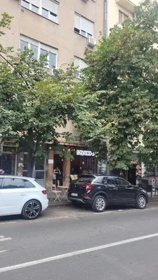 two cars parked on the side of a street at Apartment 20 in Belgrade