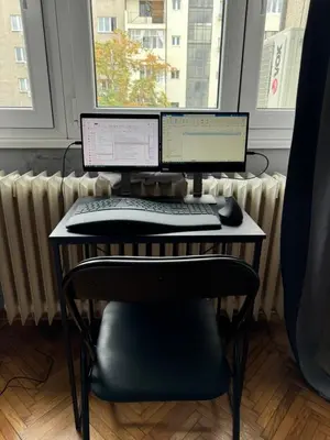 a desk with two computer monitors and a keyboard and mouse at Apartment Silver Pedestrian Zone in Belgrade