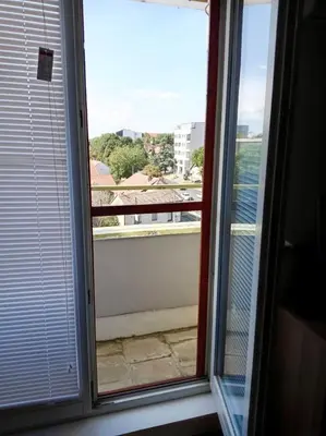 a window with a view of the water at Mansard Crimson Rhapsody in Belgrade