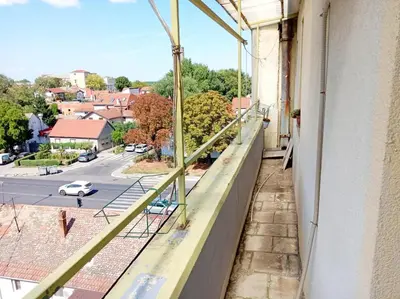 a balcony with a view of a street at Mansard Crimson Rhapsody in Belgrade