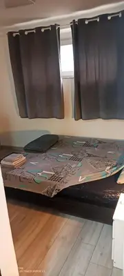 a bunk bed in a room with a window at Point apartman 1 in Belgrade