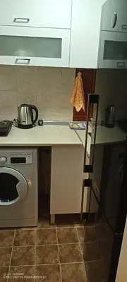 a kitchen with a stove and a counter with a pot at Point apartman 1 in Belgrade