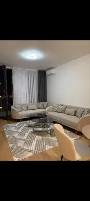 a living room with two couches and a rug at BW QUARTET Apartman-whit free garage parking in Belgrade