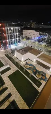 a view of a large building at night at BW QUARTET Apartman-whit free garage parking in Belgrade