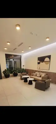 a living room with couches and tables in a room at BW QUARTET Apartman-whit free garage parking in Belgrade