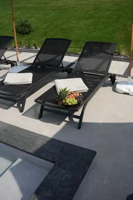 two chairs and a table with a bowl of fruit at Aeri Nature Concept in Baljevac