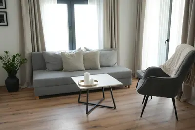 a living room with a couch and a table at Aeri Nature Concept in Baljevac