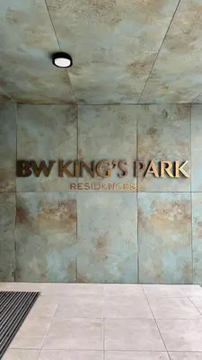 a building with a sign on the side of a wall at DOM Boutique Apartments KING'S in Belgrade