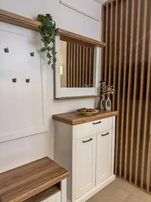 a kitchen with white cabinets and a mirror at Maison Dositej No20 in Belgrade