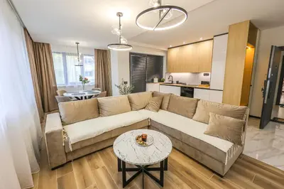 a living room with a couch and a table at Apartment Cocosinella in Surčin