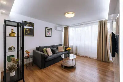a living room with a couch and a table at Marshal Autokomanda in Belgrade