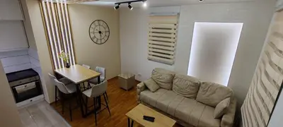 a living room with a couch and a table at Royal lux apartman Beograd in Belgrade