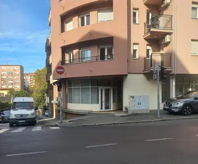 a van is parked in front of a building at Royal lux apartman Beograd in Belgrade