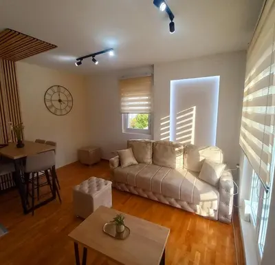 a living room with a couch and a table at Royal lux apartman Beograd in Belgrade