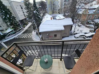 a view of a balcony with a table and chairs at Royal lux apartman Beograd in Belgrade
