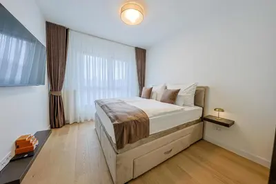 a bedroom with a large bed in a room at ZIGZAG Belgrade Waterfront King in Belgrade