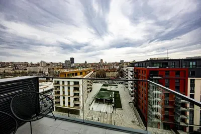 a view of a city from a balcony at ZIGZAG Belgrade Waterfront King in Belgrade