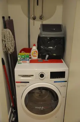 a washing machine with a box on top of it at BW Studio Oasis! Garage, Terrace, Kula&Galerija! in Belgrade
