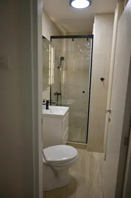 a bathroom with a toilet and a sink and a shower at Ellie Star Apartment in Belgrade