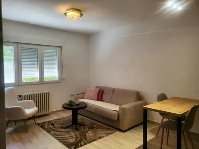 a living room with a couch and a table at Ellie Star Apartment in Belgrade