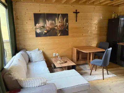 a living room with a couch and a table at Beli Bor in Vračar (historical)