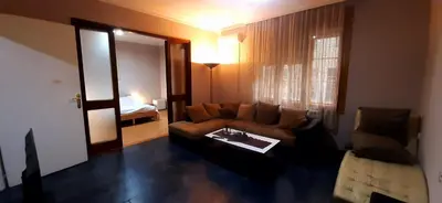 a living room with a couch and a table at Apartman Savka in Belgrade