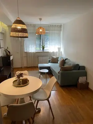 a living room with a couch and a table at Belgrade Blue Oasis in Belgrade