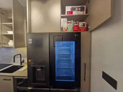 a refrigerator with its door open in a kitchen at Urban Central Stay Belgrade in Belgrade