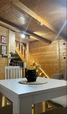 a table with a black mug on it in a room at Brvnara Balorig in Barič