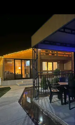 a house with a table and chairs in front of it at Brvnara Balorig in Barič