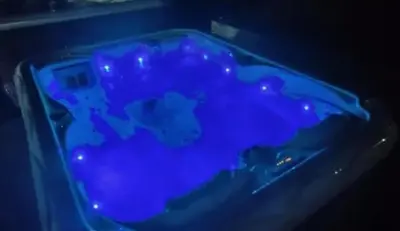 a blue tub filled with blue liquid in a dark room at Brvnara Balorig in Barič