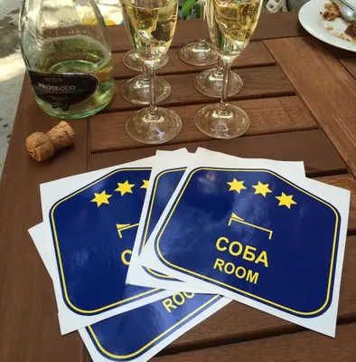 a table with a napkin that says cola room at Bed&Breakfast kod Smilje in Belgrade