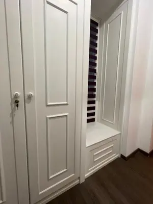 a closet with a white door and a shelf at Skadarlija Residence in Belgrade