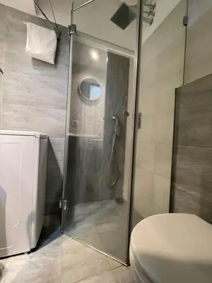 a shower in a bathroom with a toilet at Skadarlija Residence in Belgrade