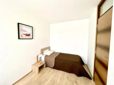 a bedroom with a bed in a room at Cozy apartments in Belgrade, Čukarica, Železnik, free parking and WiFi in Belgrade