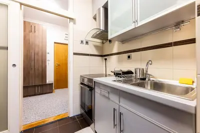 a kitchen with a sink and a counter top at Arena public FREE parking in front of building in Belgrade